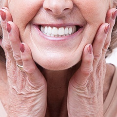A woman enjoying her new dentures