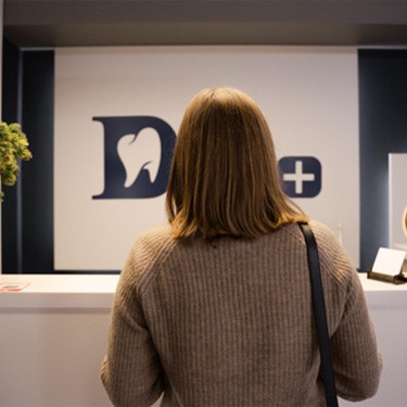 Woman checking in for dental appointment 