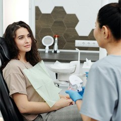 Woman in dental chair for checkup