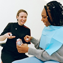 Dentist discussing dental crown with patient