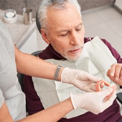 Man with dentures at the dentist