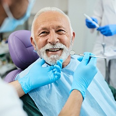 A happy senior man receiving dental care