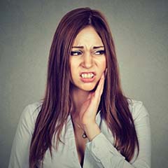 Woman wondering about her toothache in Sunnyvale