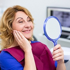 Woman smiling after learning benefits of dental implants in Sunnyvale