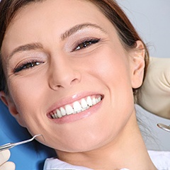 Woman with dental implants in Sunnyvale smiling at the dentist