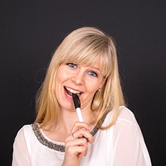 Woman chewing on a pen