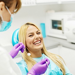 Woman laughing while in dental chair