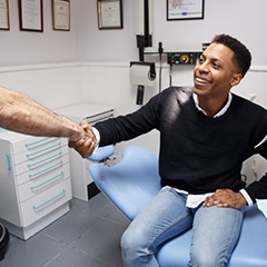 man shaking his dentist’s hand 