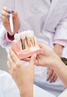 dentist explaining dental implants to patient 