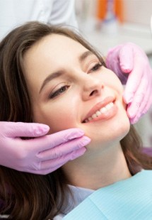 patient smiling in dental mirror 