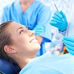 Happy woman in dental chair