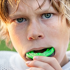 Teen boy placing sportsguard