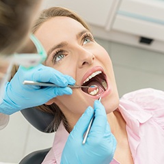 Woman receiving oral cancer screening