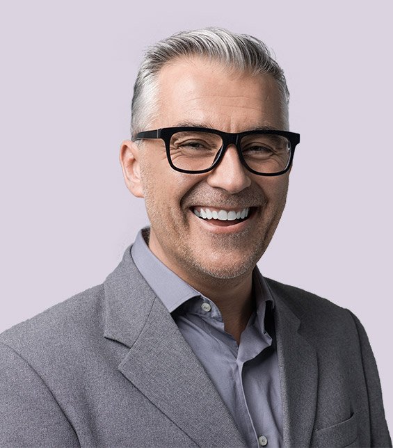 Smiling older man wearing gray suit jacket