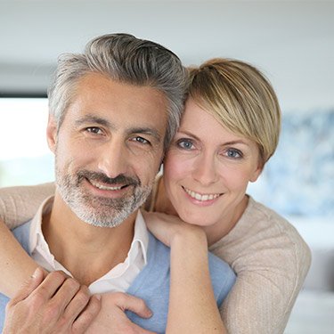 Man and woman smiling together