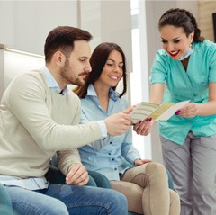 Dental patients consulting a dentist about insurance