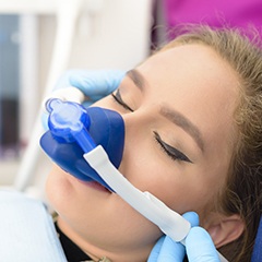 Woman with nitrous oxide nasal mask