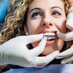 Dentist fitting a patient for an occlusal splint