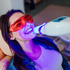 A woman receiving in-office teeth whitening