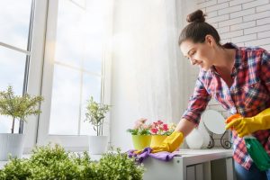 person smiling and cleaning
