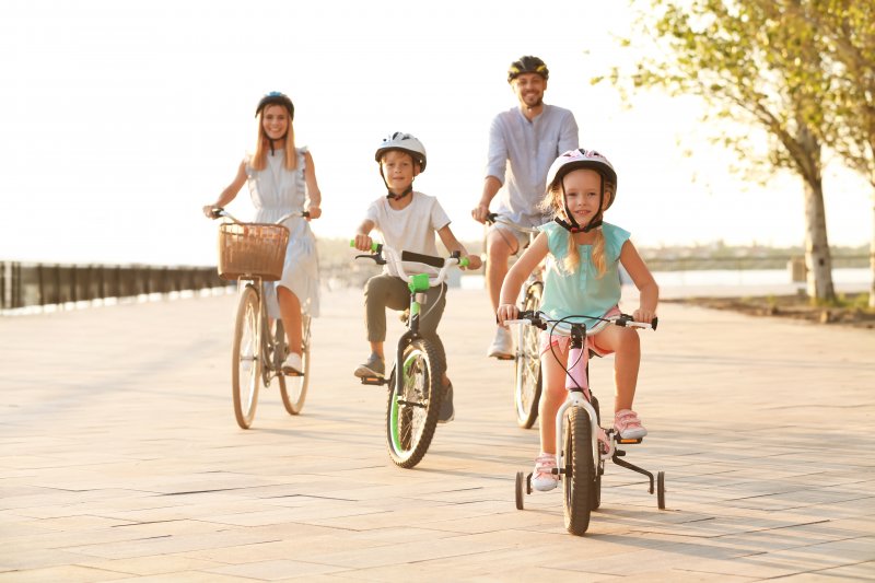 family biking together during summer