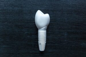 Zirconia dental crown on black background