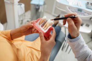 Woman learning if she is a good candidate for dental implants